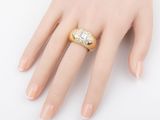 a close up of a person ' s hand with a ring on it