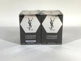two boxes of yslhomme perfume sitting on a white surface
