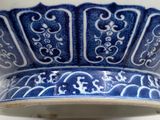 a blue and white bowl on a white table