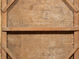 a wooden window that has a wooden frame on it