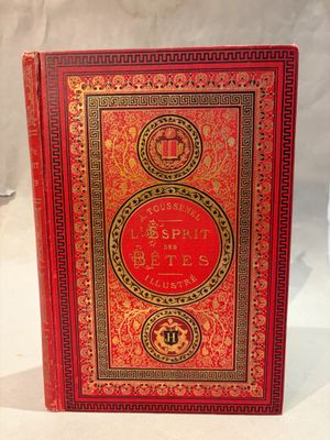 un livre rouge avec des bordures dorées et une couverture rouge
