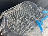 a plastic bag on top of a toaster oven