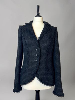 a close up of a black jacket on a mannequin mannequin