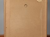 an old picture frame sitting on top of a wooden bench