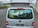 a silver van that is parked on the side of the road