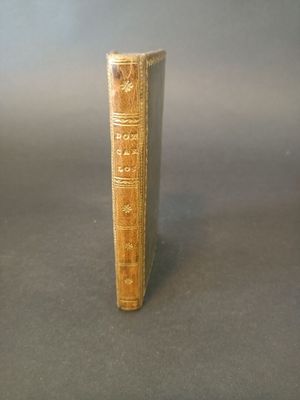 an old book that is sitting on a table