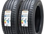 une paire de pneus sur lesquels est inscrit « vendu par lote 2 »