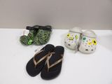 three pairs of sandals and a pair of slippers on a table