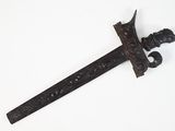 a very old sword that is on display on the wall