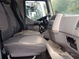 a picture of the inside of a truck with the driver ' s seat up