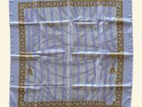 an image of a blue and white scarf with a design on it