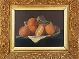 une photo d'un tableau représentant des oranges, dans un cadre doré