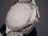 an image of a close up of a watch on a black surface