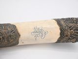 a close up of a large horn with writing on it