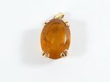 an image of a ring with a large orange stone on it