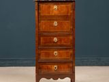 an antique wooden chest of drawers with marble top