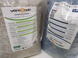 two bags of rice sitting next to each other on a counter
