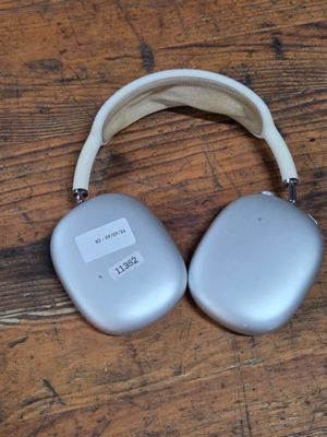 a pair of headphones sitting on a wooden table