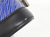 a purse that has a blue and white design on it