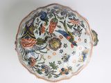 a white bowl with a floral design on it