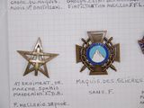 four badges on a piece of paper with writing on it