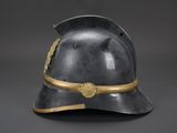 an old helmet with a gold band on it