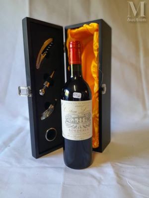 a bottle of wine in a case with a bottle opener