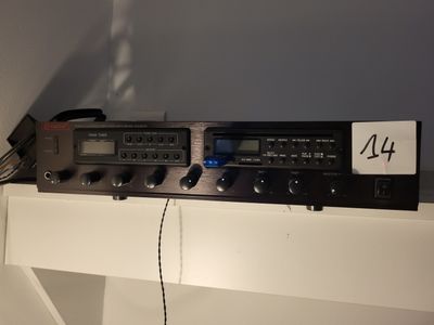 a picture of a radio on a shelf with a lot of wires