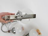 a person that is holding a light bulb in their hand