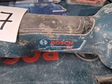 a close up of a corded sander with a number on it