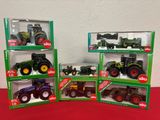 four different models of tractors in the boxes