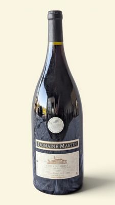 a bottle of wine that is sitting on a table