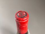 a bottle of wine that is sitting on a table