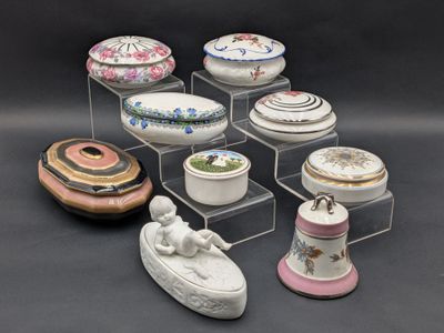 many different types of porcelain dishes on display