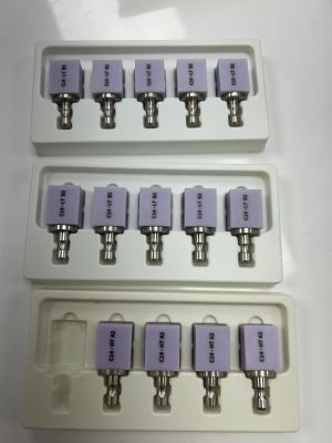 four white trays with six different sizes of switches on top of each other