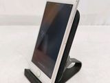 a cell phone that is sitting on a stand