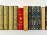a row of books that are lined up on a shelf