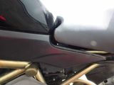 a close up of a motorcycle parked on the street