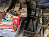 a pile of assorted items on a shelf in a garage