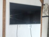 a flat screen tv mounted on the wall in the living room