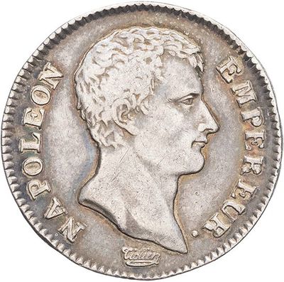a close up of a coin with a man ' s head on it