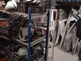 a large pile of assorted items in a garage