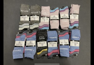 six pairs of men ' s socks with labels on them