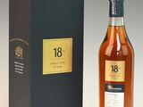 a bottle of 18 year old whisky next to a box