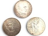 three different types of coins are shown on a white surface