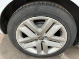 a close up of a tire on a white car