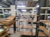 a blurry photo of a factory with many tables and chairs