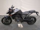 a picture of a motorcycle parked on a checkered floor