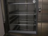 a refrigerator that has a clock on the door