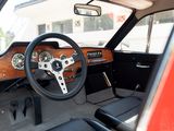 a steering wheel and dashboard of a red car